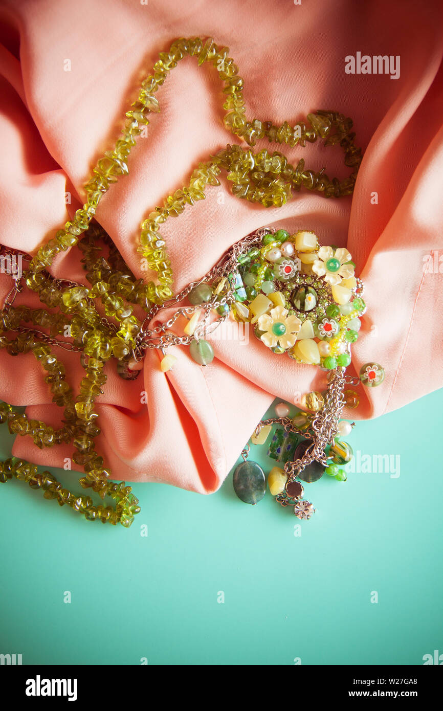 vintage colorful background with granny`s green necklace. Memories concept, photo with copy space Stock Photo